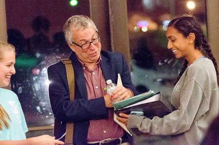 Robert Citino, professor of History at the University of North Texas , gladly signs his book for a high school student after the history lecture in the G.M. Savage Memorial Chapel. - Photo by David Parks