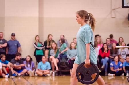 Lindsey Davis, freshman biology major, competes for Chi Omega in the farmer's walk during the Union's Fittest Team competition. - Photo by David Parks