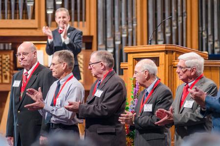 Union University alumni applaud one another during the homecoming chapel. - Photo by David Parks