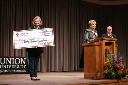 Members of the class of 1965 present a gift of an endowed scholarship to the students of Union University during Homecoming chapel. - Photo by Kristi McMurry Woody
