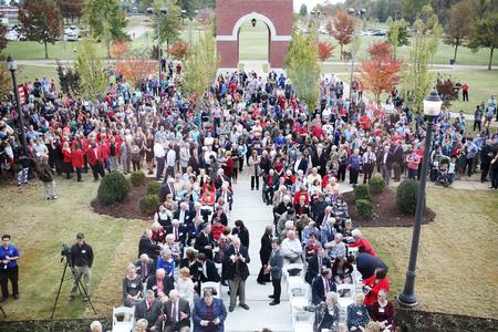 Faculty, staff, students and guests gather outside The Logos for the dedication service during Homecoming weekend. - Photo by Kristi McMurry Woody