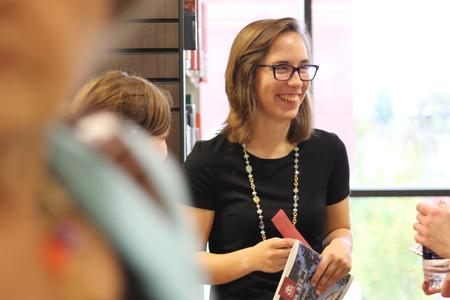 Bridgette Wilson, senior, helps guide students, faculty, and guests tour the new library, The Logos. - Photo by Sol Bee Park