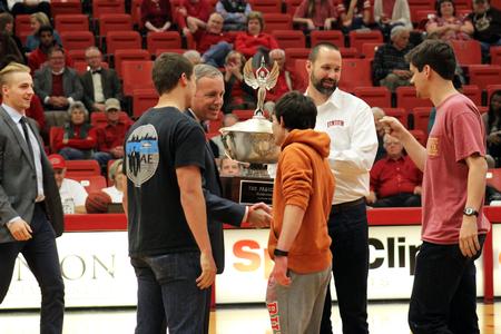 Dub Oliver, president of the university, and Bryan Carrier, vice president for student life and dean of students, presents the President Cup to the men of Sigma Alpha Epsilon.  - Photo by Sol Bee Park