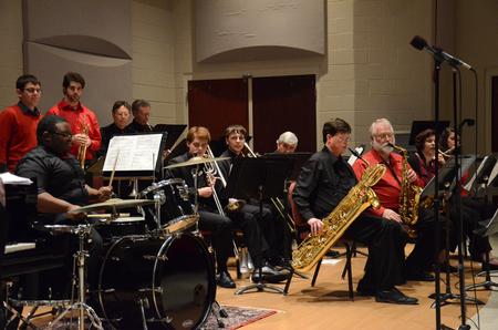 Ryan Nelson, junior music education major, performs a series of drum solos during the jazz band concert in Hartley Hall. - Photo by MiKalla Cotton