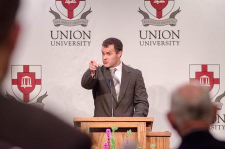 Jon Hoover, recipient for the Outstanding Young Alumnus Award, addresses the audience with encouragement during the Meritorious Service Awards Banquet in the Carl Grant Events Center. - Photo by David Parks