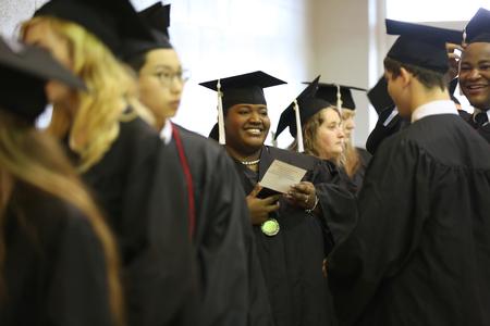 Veronica Perry, public relations graduate, lines up with her classmates prior to fall commencement services. - Photo by Kristi McMurry Woody
