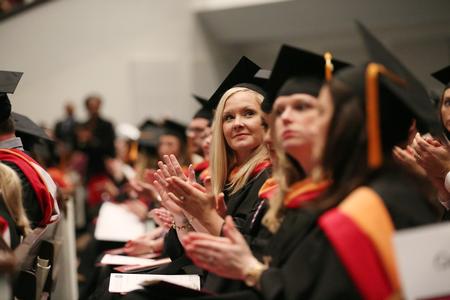 Graduates applaud at fall commencement services to thank friends and family for their support. - Photo by Kristi McMurry Woody