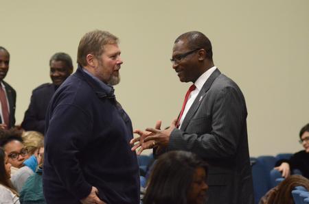 Ben Mitchell, provost and vice president for academic affairs and Graves Professor of moral philosophy, and Moses Goldmon, executive vice president at Lane College, speak during the intermission of the Diversity and Reconciliation Dialogue at Agape Christian Fellowship.  - Photo by Elizabeth Wilson