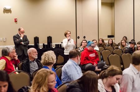 Abigail Thigpen, senior English major, presents a question to Gerardo Marti during his Scholar-in-Residence Lecture, "The Future of Racism and the Church" in the Carl Grant Events Center. - Photo by David Parks