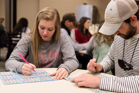 Rian Burch, senior social work major, plays Bingo alongside her fiancée, Andrew Massie in the Brewer Dining Hall. - Photo by David Parks