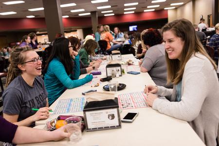 Students laugh upon nearly having matches during Bingo Night in the Brewer Dining Hall. - Photo by David Parks