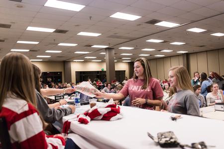 Winners step up to the stage to see if they have a Bingo match during SAC's Bingo Night in the Brewer Dining Hall. - Photo by David Parks