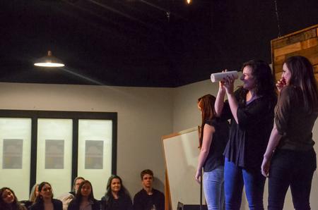 The Blank Slate improve team plays "props" for Scholars of Excellence Weekend in Barefoots Joe. - Photo by Gretchen Foels