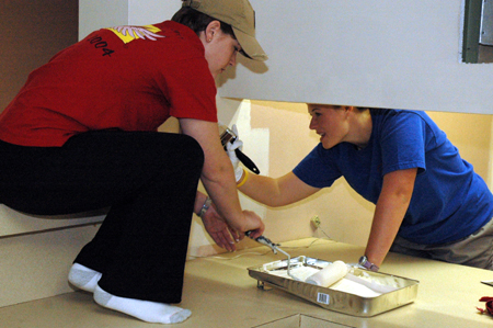Seniors Anna Curlee & Amy McCutcheon paint at The Dream Center of Jackson during Day of Remembrance. - Photo by Amanda Herron