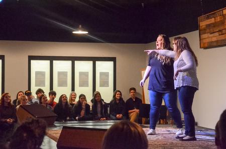 Abby Duke, senior public relations major, and Shelby Cox, senior nursing major, entertain scholars at the pop-up Blank State Improv show. - Photo by Gretchen Foels