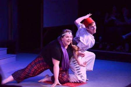 Jonathan Bowman, sophomore biology major, shows Abby Duke, senior public relations major, the world in their performance of Aladdin at the LipSync Battle.  - Photo by Gretchen Foels