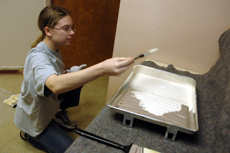 Sarah Smith paints at The Dream Center of Jackson during Day of Remembrance. - Photo by Amanda Herron