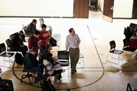 Sean Evans, professor of political science and department chair, watches the Super Tuesday results in the Bowld Student Commons with students at an election night watch party.  - Photo by Kristi McMurry Woody