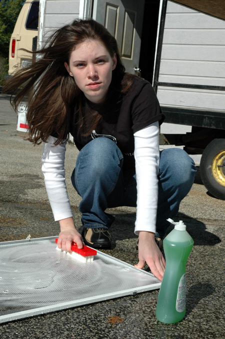 Bess Perrier washes screens at Birth Choice during Day of Remembrance. - Photo by Amanda Herron