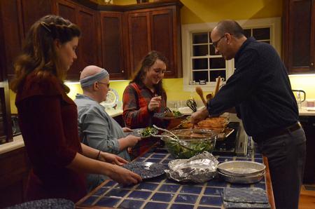 George Guthrie, Benjamin W. Perry Professor of Bible, serves students in his home for Student Activities Council's Be Our Guest event.  - Photo by MiKalla Cotton