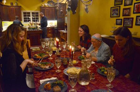Students enjoy dinner in the home of the Guthries for the Student Activities Council's Be Our Guest event.  - Photo by MiKalla Cotton