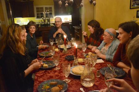 George Guthrie, Benjamin W. Perry Professor of Bible, and his wife, Pat Guthrie, enjoy dinner in their home with students for Student Activities Council's Be Our Guest event.  - Photo by MiKalla Cotton
