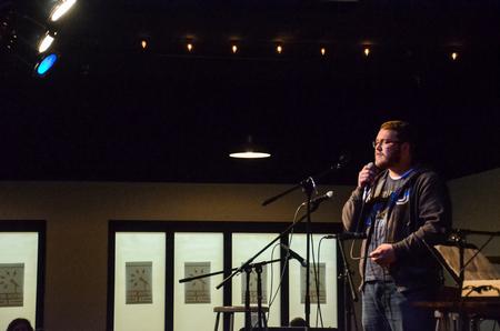 Jordan Mathenia, junior music major, performs at Barefoots Joe's Open Mic.  - Photo by Gretchen Foels