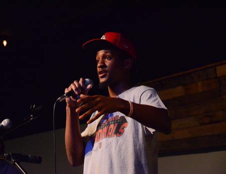 Emerick Lester, freshman athletic training, performs original songs at Barefoots Joe Open Mic Night. - Photo by Gretchen Foels