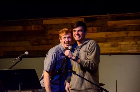 Jonathan Bowman, sophomore biology major, and Chandler Bell, sophomore marketing major, add a bit of comedy between acts during Open Mic Night. - Photo by Gretchen Foels
