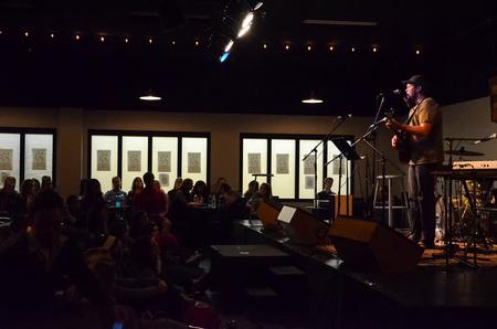 Cameron Skonhovd, junior psychology major, performs at Barefoots Joe's Open Mic.  - Photo by Gretchen Foels