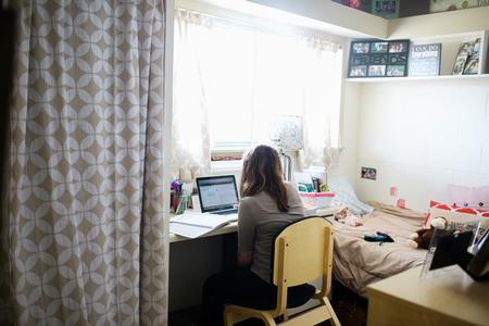 A student studies in her Heritage Complex room. - Photo by Kristi McMurry Woody