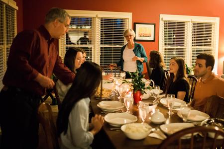 David and Nancy Thomas serve students during the annual Be Our Guest event when faculty and staff members invite students into their homes.  - Photo by Kristi McMurry Woody