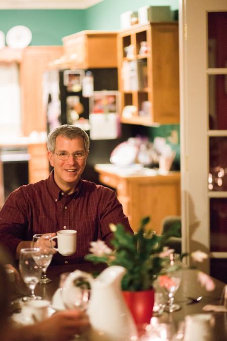 Daivd Thomas, professor of history, chats with students during Be Our Guest, an annual event when faculty and staff have students in their homes for a meal. - Photo by Kristi McMurry Woody