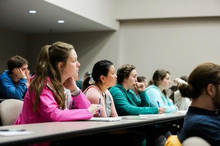 Students listen to alum and poet George David Clarke read excerpts from his book <em>Reveille</em>. - Photo by Kristi McMurry Woody