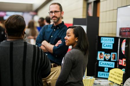 Guests of Social Work Awareness Day talk in the SUB hallway. - Photo by Kristi McMurry Woody