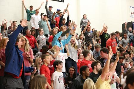 Students try to get catch t-shirts from cheerleaders during halftime of the first round of the NCAA DII South Region Tournament. - Photo by Kristi McMurry Woody
