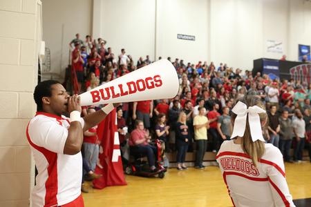 Marcellous Jiles, along with the rest of the cheer squad, lead cheers during the first round game of the NCAA DII South Region Tournament. - Photo by Kristi McMurry Woody