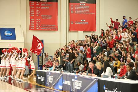The cheer squad leads the student section in a chant during the first round game of the NCAA DII South Region Tournament. - Photo by Kristi McMurry Woody