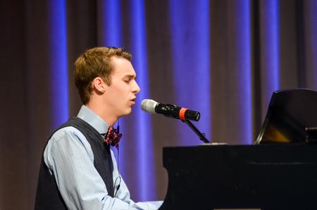 Jonathan Greer, sophomore philosophy major, sings at chapel.  - Photo by Gretchen Foels