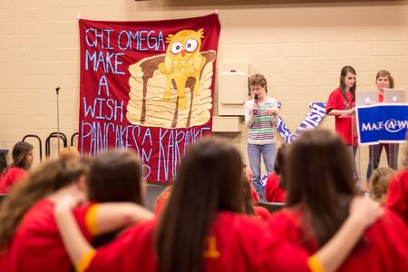 Maria Tatman, EDGE student, is supported by Chi Omega sisters as she sings karaoke in the Pancakes & Karaoke Party benefiting Make-A-Wish® Mid-South. - Photo by David Parks