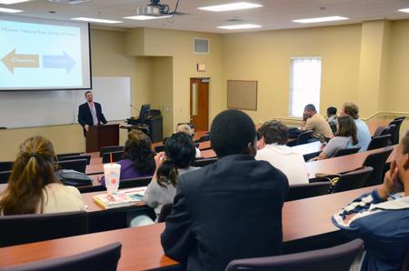 Justin Barnard, associate professor of philosophy, speaks on death and dying during a Town & Gown lecture series in Providence Hall. - Photo by MiKalla Cotton