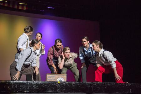 Chi Omega sisters "listen in" to a radio broadcast in their Variety Show performance. - Photo by David Parks