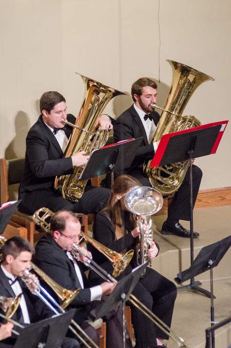 Tuba players Jacob Smith, senior Biblical studies major, and Jacob Mathis, junior business major, uphold the lower side of sound within the band during the Symphonic Band concert. - Photo by David Parks