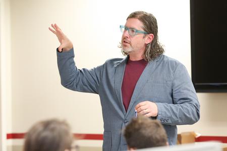 Ted Kluck, assistant professor of communication arts, teaches a class.  - Photo by Kristi McMurry Woody
