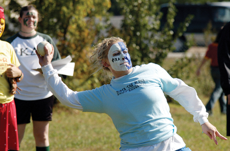 Zeta Freshman Cheslie Tharpe prepares to launch a softball during the Greek Olympics. - Photo by Kristen Hiller