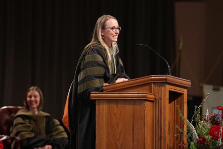 Kim Jones, assistant dean of student services for pharmacy, addresses the graduating class during the Pharmacy Awards Service. - Photo by Kristi McMurry Woody