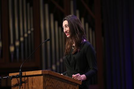 Anna Goodman, graduating senior and class president, welcomes guests and graduates to the Graduate Commissioning Service.  - Photo by Kristi McMurry Woody