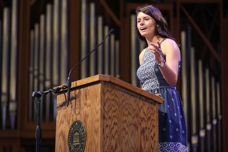 Clare Williams, intercultural studies graduate, speaks to her classmates at the Graduate Commissioning Service. - Photo by Kristi McMurry Woody