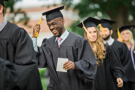 Jeremiah Murila, engineering graduate, processes to the Great Lawn to begin the spring commencement services.  - Photo by Kristi McMurry Woody
