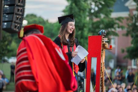 Anna Goodman, senior class president, heads to the podium to present the senior class gift.  - Photo by Kristi McMurry Woody